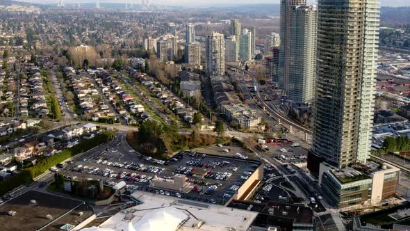 Flying Over Brentwood Town Centre, Shopping Mall In Burnaby, British Columbia, Canada. - aerial alt