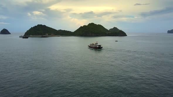 Pictorial Aerial View Tourist Boat Sails To Island Pier alt