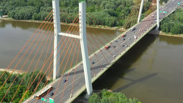 Modern cable stayed bridge and car traffic on background. Highway traffic jam. Aerial View alt