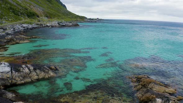 Flying Above a Beach with Clean Turquoise Water in Lofoten Islands Norway alt