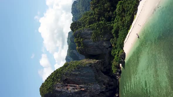 Vertical Drone Aerial View on Tropical Paradise, Hidden White Sand Beach With Cliffs and Rainforest alt