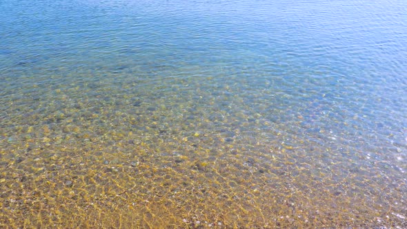 Crystal Clear Seawater. Summer Concept. Word Summer. Pebbled Seabed. Stones Under Water. Climate