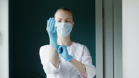 Nurse Puts On Gloves 2