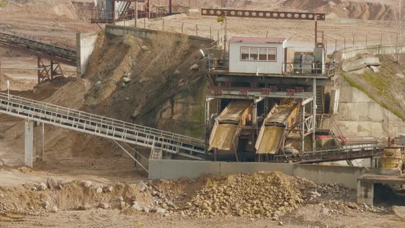 Conveyor Line Sorts Sand and Stone on the Ballast Quarry alt