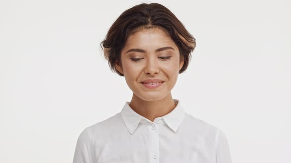 Young Beautiful Brunette East Asian Female in Shirt Snaping Eyes at Camera Smiling Laughing Showing alt
