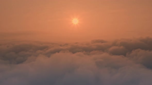 Fluffy Cumulus Clouds Float Under alt