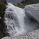 Bottom view of High Waterfall Falling in Snowfield - VideoHive Item for Sale