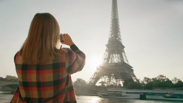 Back View of Lady Taking Photo By Smartphone of Eiffel Tower in Paris France