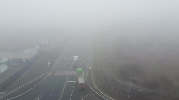 Strong Fog on the Road Aerial Drone View
