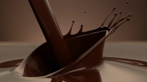 Super Slow Motion Shot of Pouring Melted Chocolate on Brown Gradient Background at 1000 Fps alt