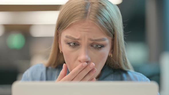 Close Up of Woman Reacting to Loss While Using Laptop alt