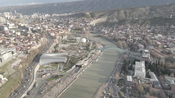 Aerial view of Tbilisi city central park and Bridge of Peace. Beautiful cityscape of old Tbilisi alt