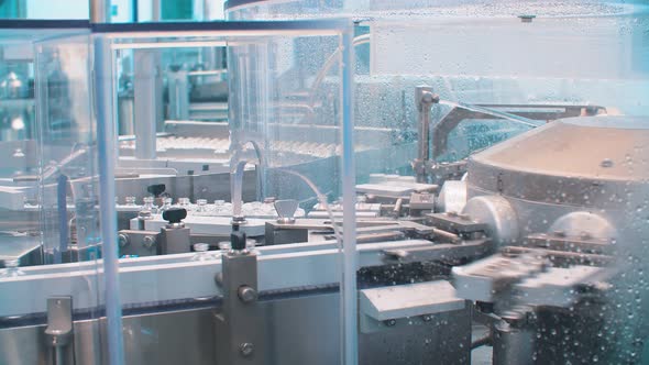 Pharmaceutical Production Machine for Medical Vials and Vials. Manufacturing of the Vaccine alt