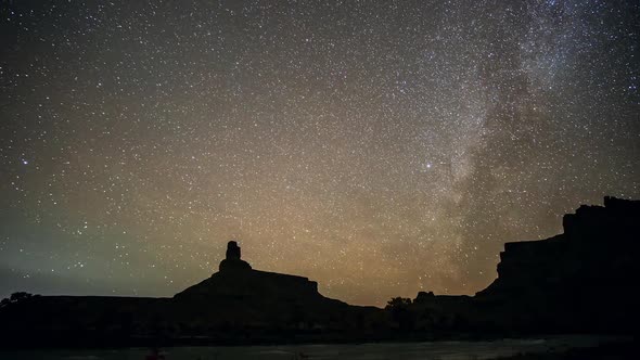 Star timelapse as milky way fades into the landscape in the desert alt