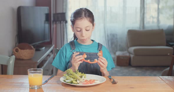 Child nutrition - girl refusing to eat healthy food alt