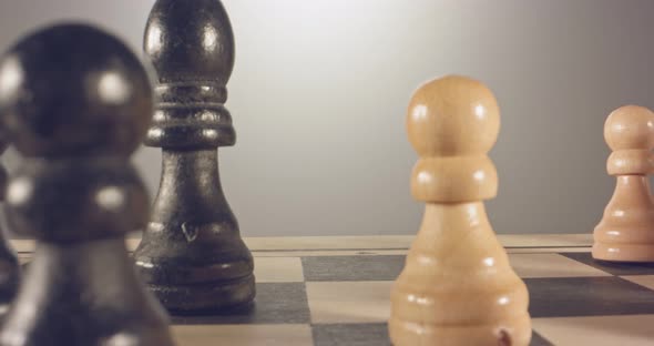 Special tracking macro shot moving between chess pieces on a chess board alt