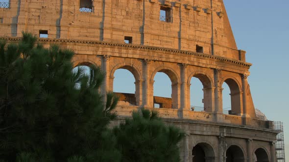 The Colosseum facade at sunset in Rome