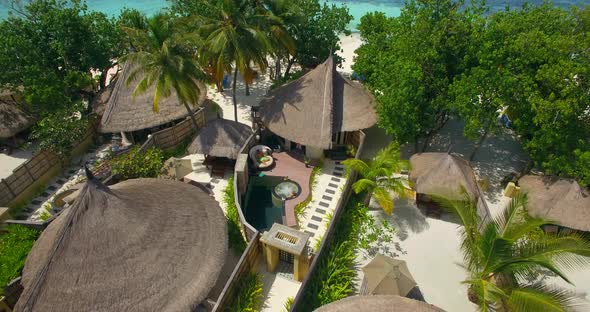 Aerial drone view of a couple at a spa resort hotel alt