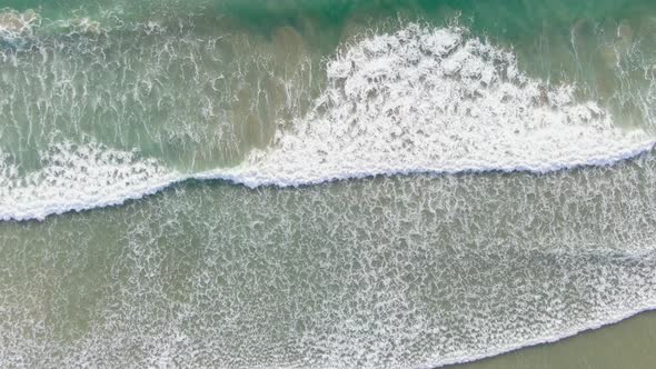 Aerial top down view of waves breaking on reef