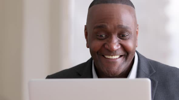 Male Portrait African Mature Businessman Middleaged Employer Afro Entrepreneur Looking at Laptop alt