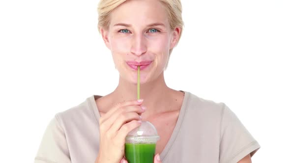 Pretty Blond Woman Drinking Vegetable Juice alt