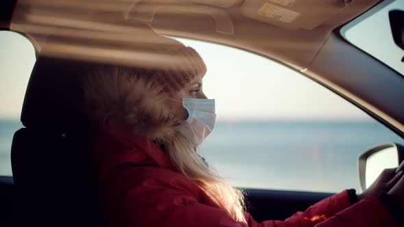 Woman Traveler Riding On Trip Holiday Vacation Adventure On Vehicle SUV. Female In Face Mask. alt