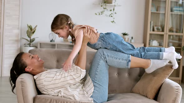 Woman Playing with Kid alt