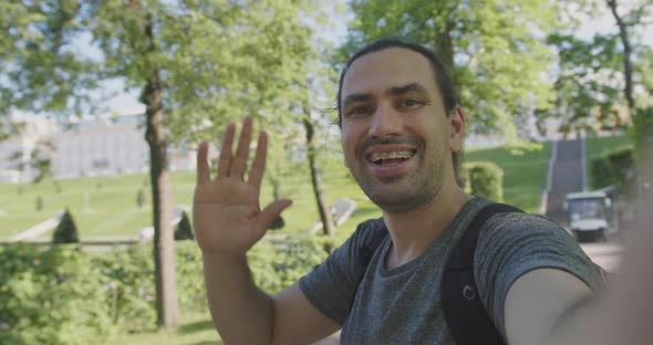 A Woman in a Beauty Salon Applies a Moisturizing Tissue Mask to Her Face alt