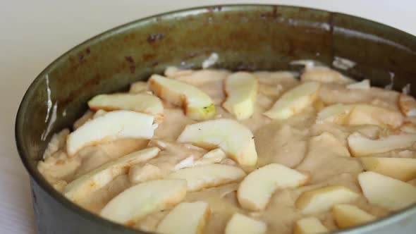 A Woman Makes An Apple Pie. Cooking Charlotte At Home. Shooting The Camera On The Slider. Close Up..