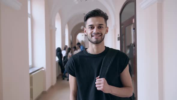 Cheerful Student Smiling, Posing in University Hall alt