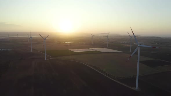 Wind turbine farm on beautiful morning landscape