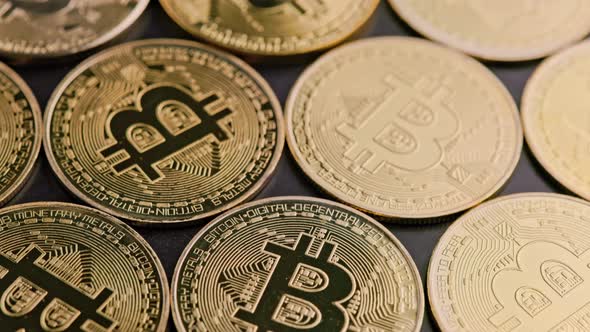 Bitcoin Coins on Black Background  Closeup Fullframe Spinning Background alt