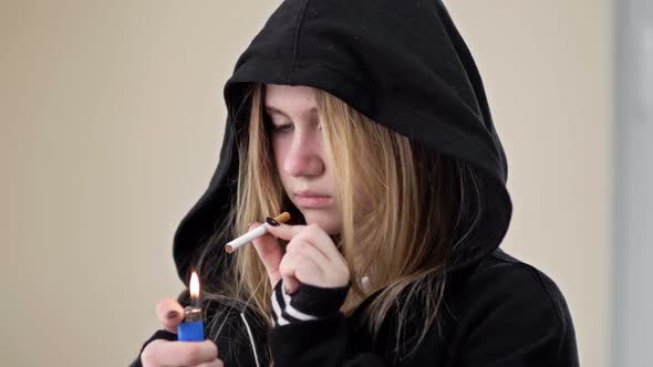 A Teenage Girl is About to Smoke but Something Stops Her