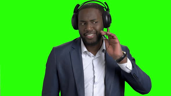 Happy Businessman in Headphones Listening To Music alt