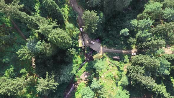 Aerial Footage of Evergreen Trees at Jana Waterfall , Manali , Himachal Pradesh, Looking Down alt