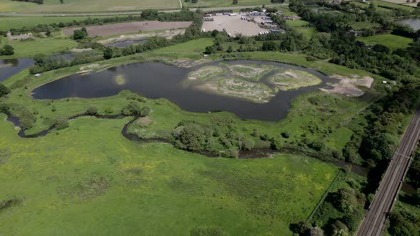 Nature Reserve By Truck Stop And Railway Track Aerial View