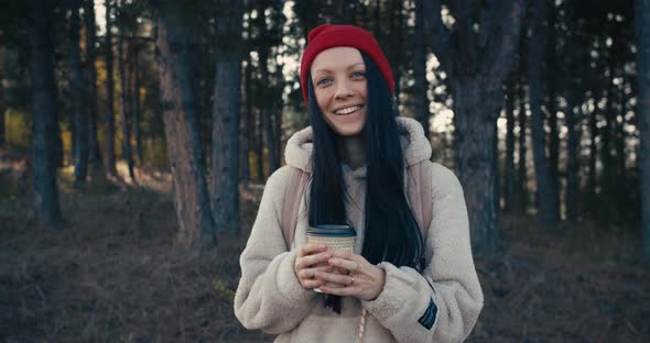Young Female Smiling And Drinking Coffee