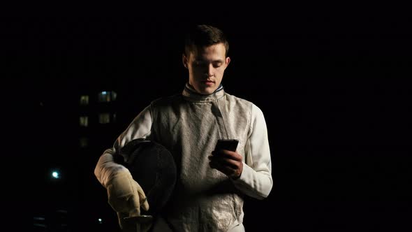 Portrait Of Young Fencer Man Looking Into Camera On The Street. alt