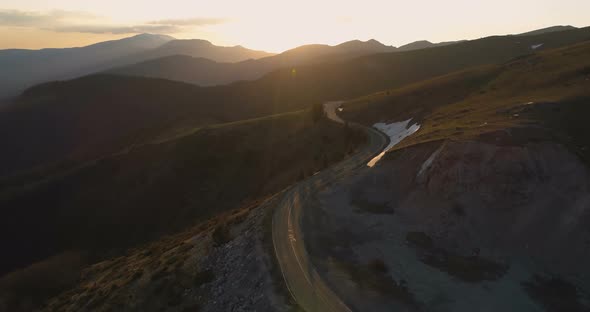 Sunset Over Winding Remote Road in the Mountains alt