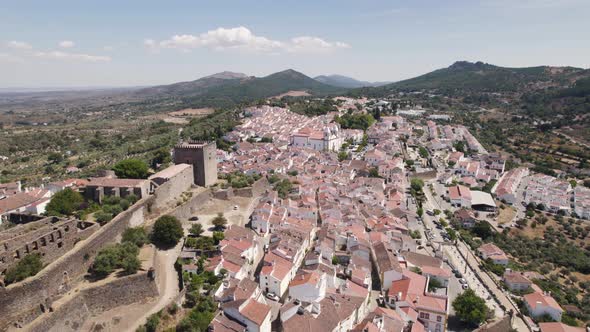 Aerial flyover Castelo de Vide Cityscape, Traditional Alentejo town on sunny day alt