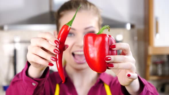 Woman Holds Chilli and Bell Pepper