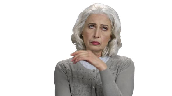 Portrait of Upset Mature Woman on White Background alt