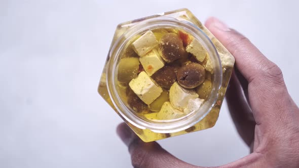 Cheese Cube  Olive and Herbs in a Container