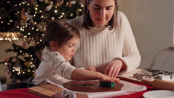Mother and Daughter Making Gingerbread at Home
