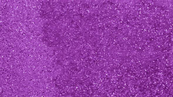 Purple Sparkle and Glowing Particles Wave and Light Abstract Background