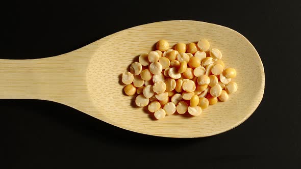 Yellow Peas Appear In Wooden Spoon alt