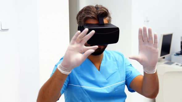 Dentist using virtual reality headset alt