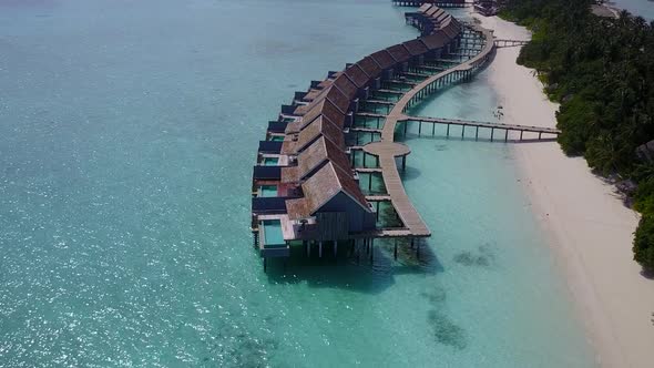 Daytime abstract of shore beach by blue water and sand background before sunset alt