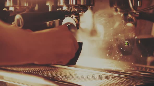 Barista Making a Cup of Strong Coffee in a Coffee Machine