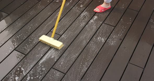 Woman Cleaning Floor with Brush alt